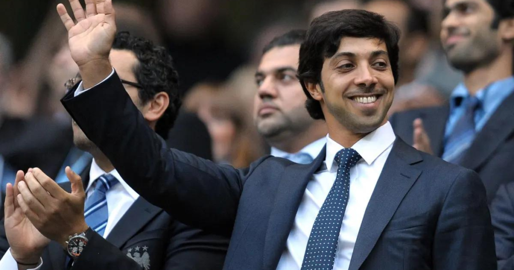 Sheikh Mansour Net Worth: How He Acquired Multi-Billion Dollars Empire? sheikh mansour waving to fans during a football match